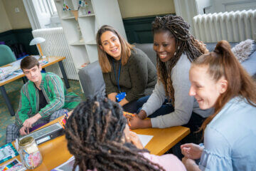 group of students chatting and smiling